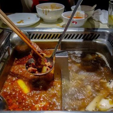Why did two teenagers urinate in hotpot broth at a Chinese restaurant?