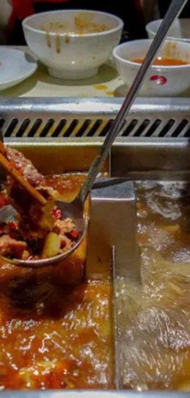 Why did two teenagers urinate in hotpot broth at a Chinese restaurant?