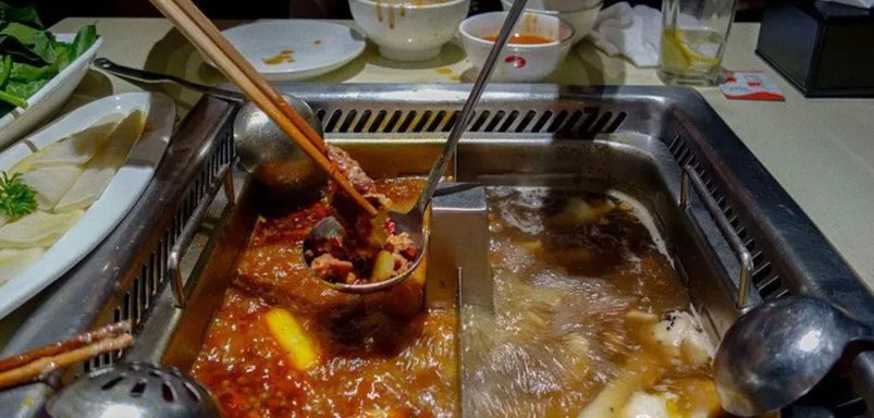 Why did two teenagers urinate in hotpot broth at a Chinese restaurant?