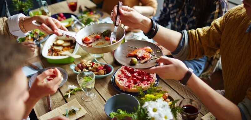 Why do humans enjoy the tradition to feast together?