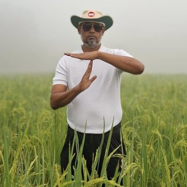 Why is a BNP leader standing in a paddy field making a cricket-style gesture?