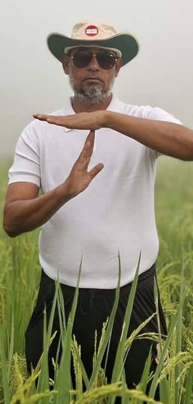 Why is a BNP leader standing in a paddy field making a cricket-style gesture?