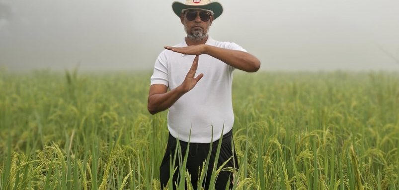 Why is a BNP leader standing in a paddy field making a cricket-style gesture?