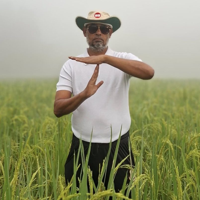 Why is a BNP leader standing in a paddy field making a cricket-style gesture?