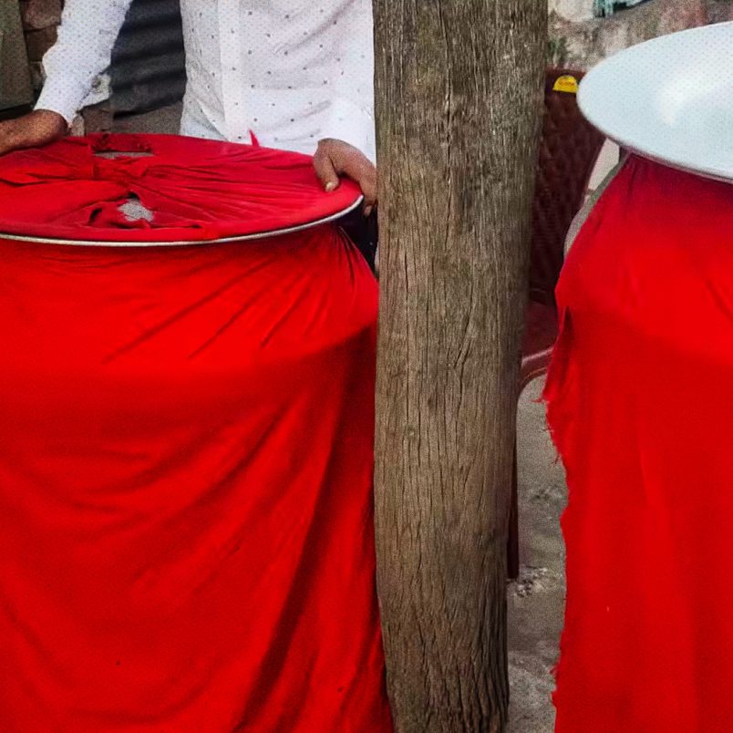 Why do Biryani pots have red cloth wrapped around them?