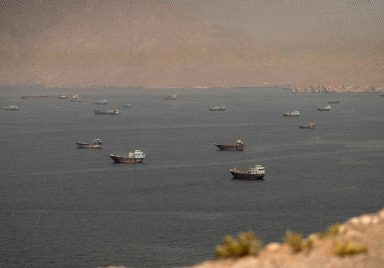 Why is the IMO helping evacuate 11,000 stranded sailors from the Strait of Hormuz?
