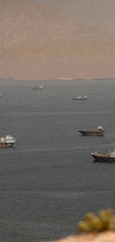 Why is the IMO helping evacuate 11,000 stranded sailors from the Strait of Hormuz?