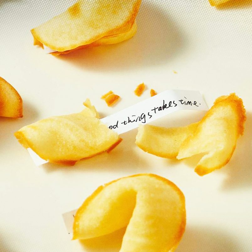 What is the history behind fortune cookies and how are they made?