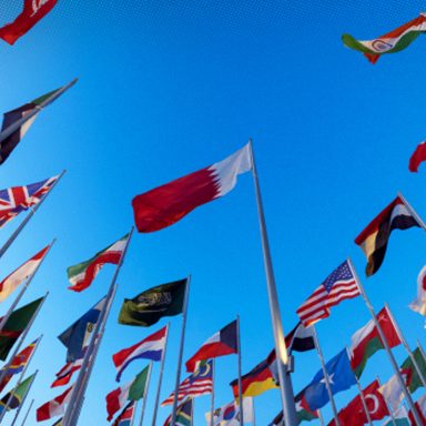 Which nationalities dominate Qatar's population?